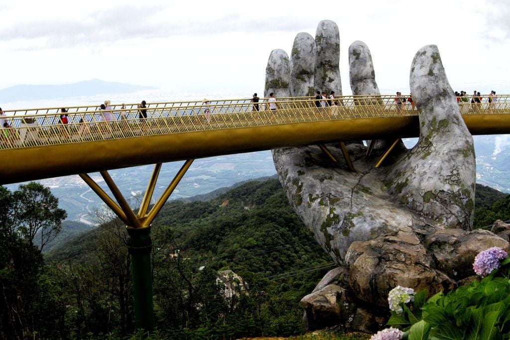 Tourists are flocking to see the giant hands on the Golden Bridge