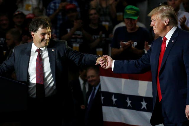 Ohio Senator Troy Balderson shakes hands with President Donald Trump during a Make America Great Again rally