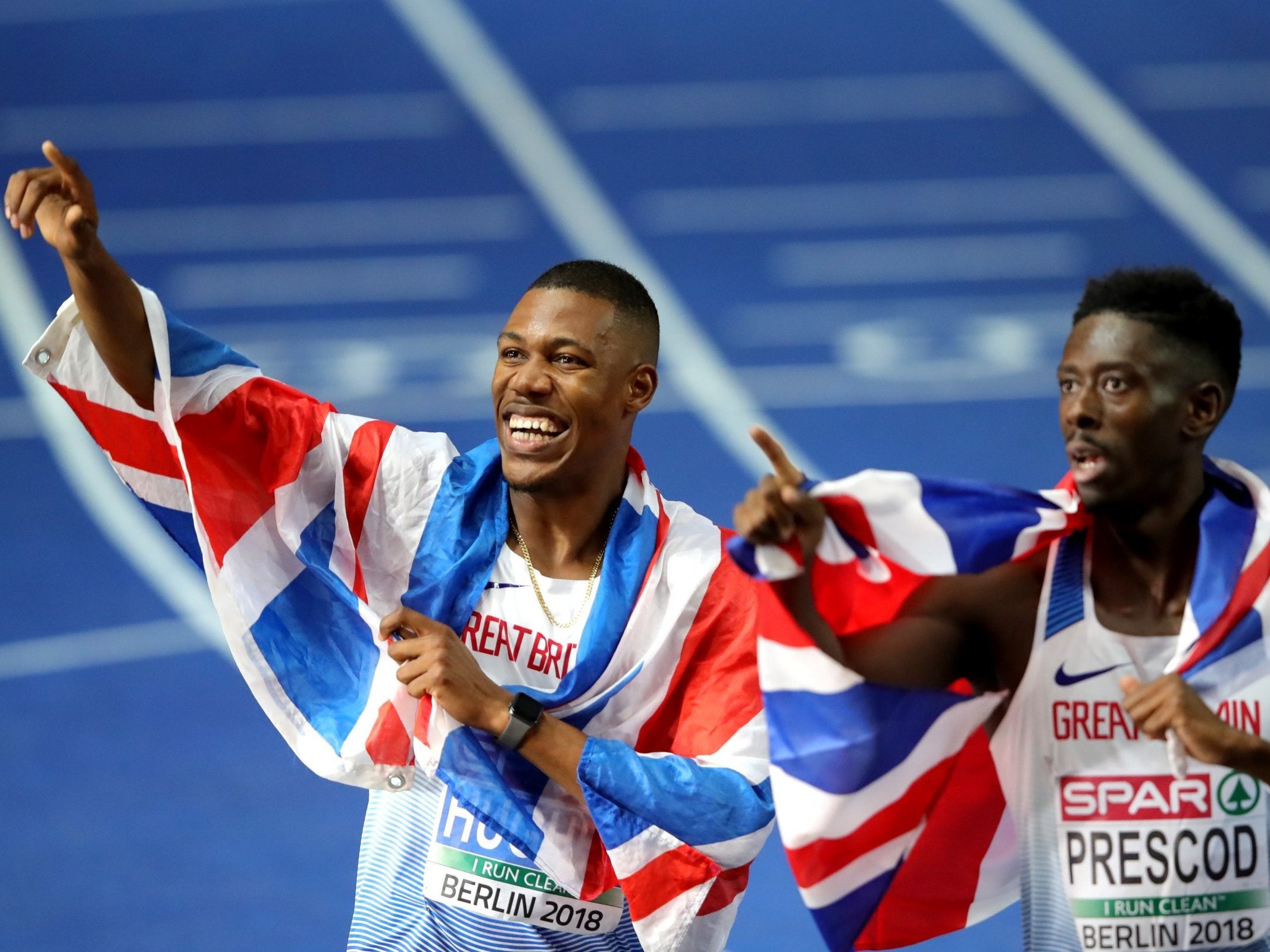 Zharnel Hughes, left, celebrates alongside Reece Prescod