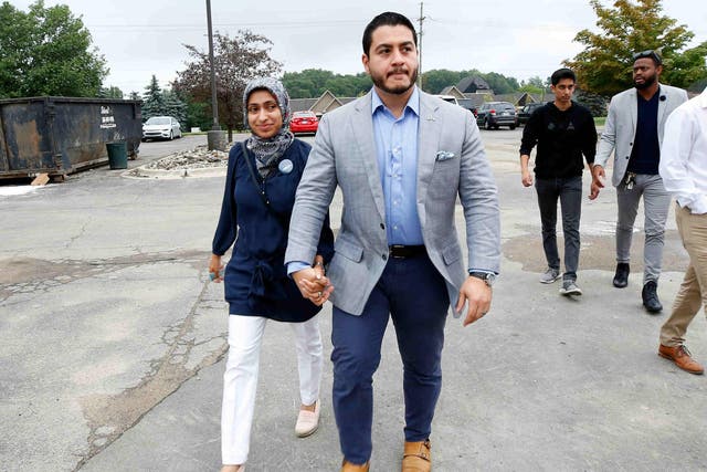 Democratic Governor candidate Abdul El-Sayed arrives to vote with his wife Sarah Jukaku in Shelby, Michigan
