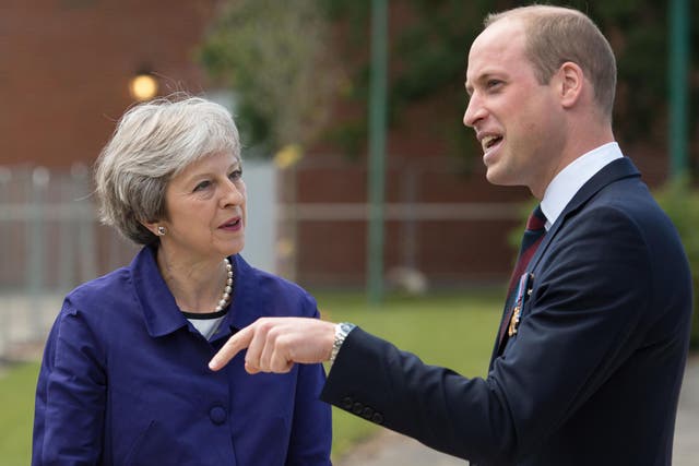 Theresa May and the Duke of Cambridge attend the official handover of the newly built Defence and National Rehabilitation Centre earlier this year