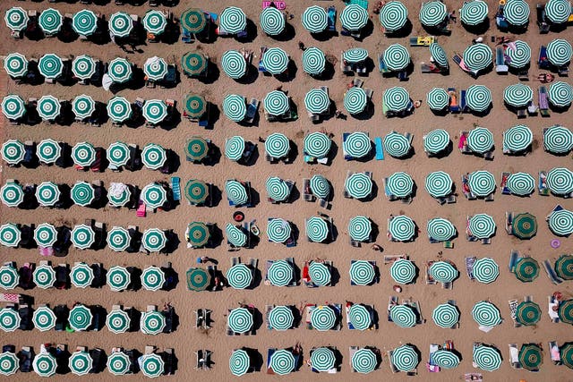 Parasols on a beach of the Adriatic Sea in Durres, as a heatwave sweeps across Europe. Temperatures rose to 38 degrees Celsius in Albania.