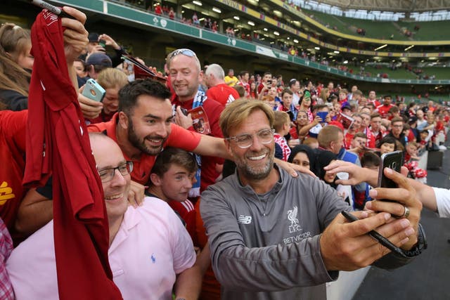 Jurgen Klopp takes selfies with supporters in Dublin