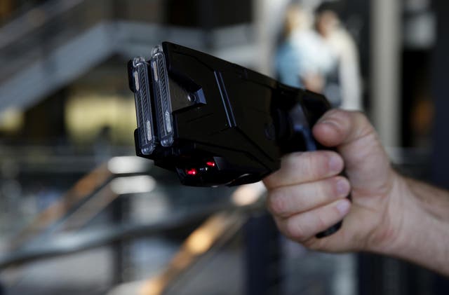 The Taser X2 electronic weapon is displayed for a photograph at the Taser International Inc manufacturing facility