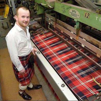 Jamie Pringle with the tartan he designed to celebrate the unlikely pairing