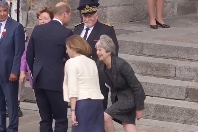 Theresa May performs her signature crooked lunge for the third-in-line to the throne