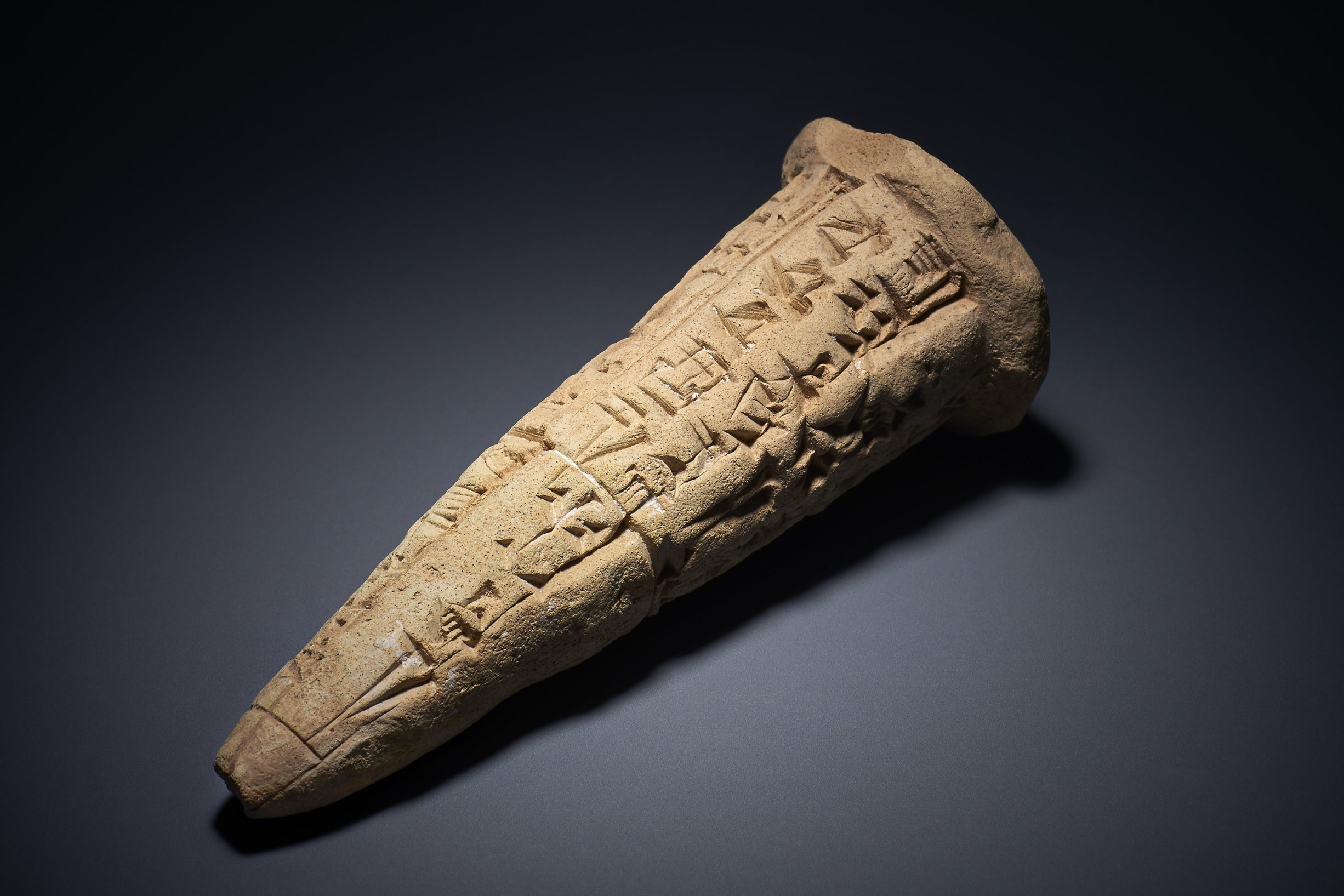 The objects being returned to Iraq include three complete fired clay cones, each with an identical cuneiform inscription