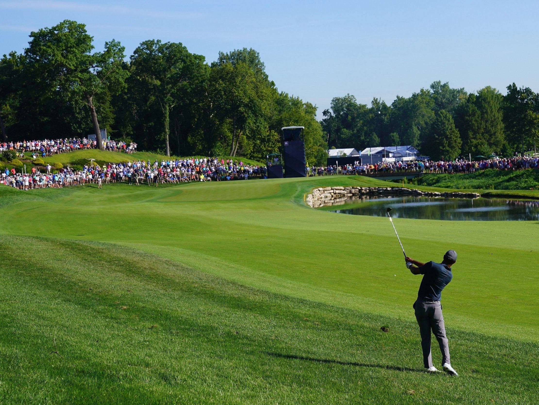 Tiger Woods plays his approach to the 11th green