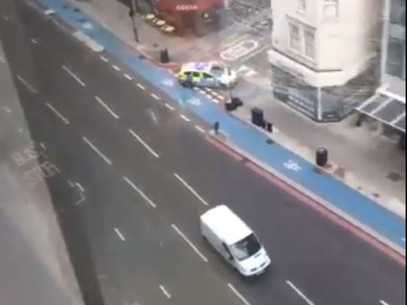 Police shut down an area outside Aldgate East