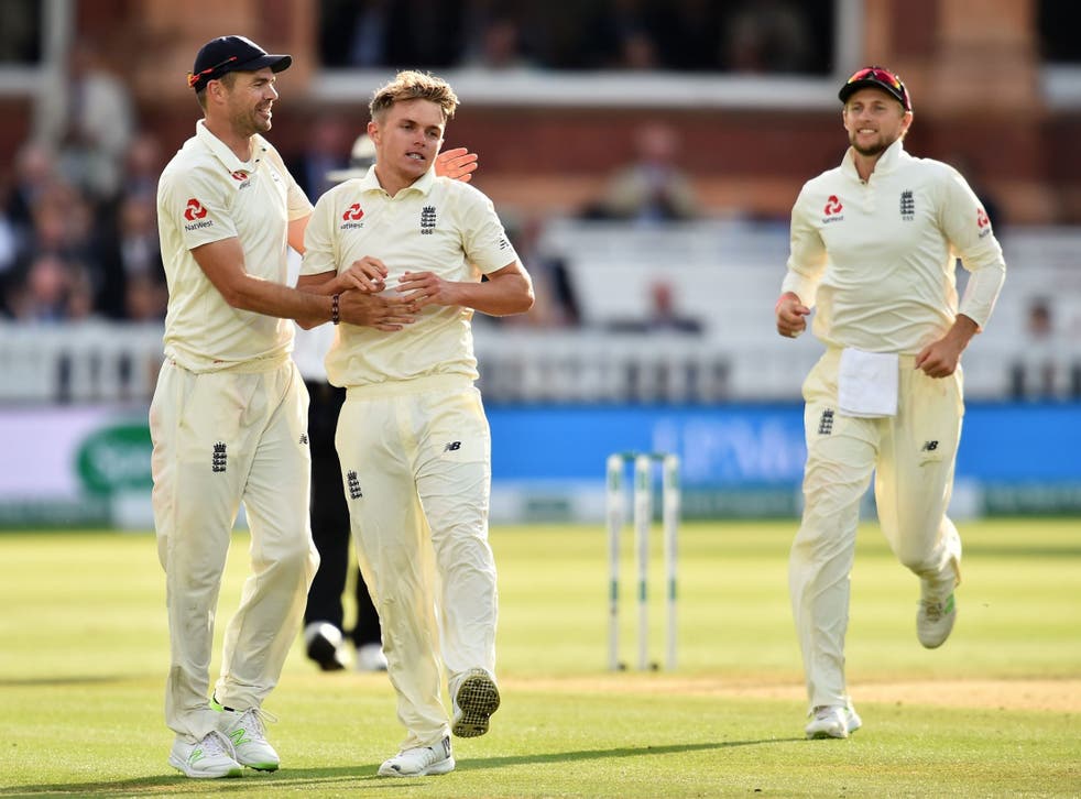 Sam Curran celebrates with James Anderson and Joe Root