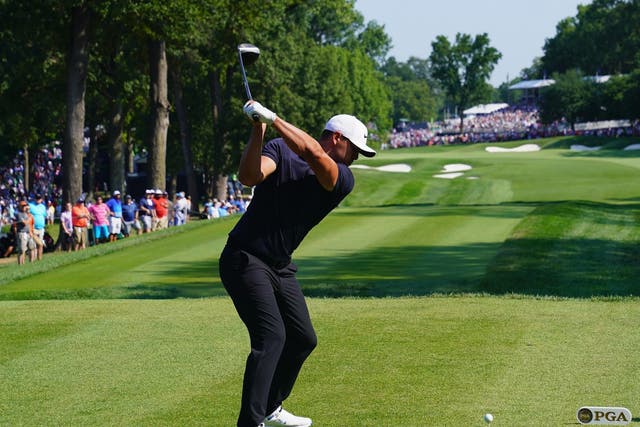 Brooks Koepka plays his tee shot at the 18th