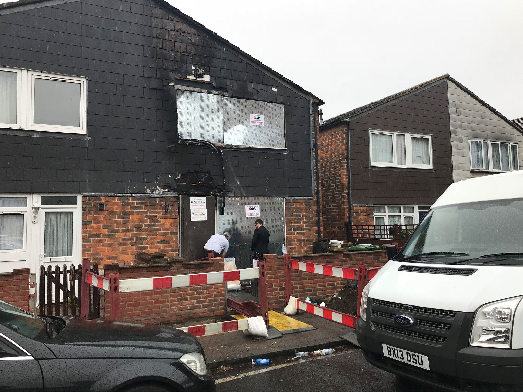 The Uhrie family's home remains boarded up following the fatal fire earlier this week