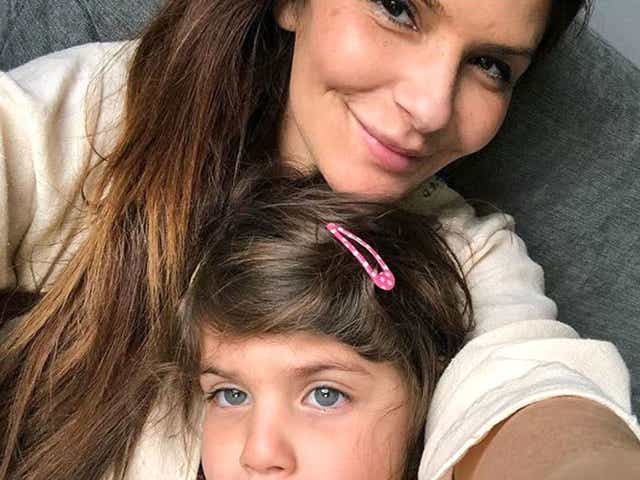 Ellie Holman and her daughter were detained in Dubai after the dentist drank a glass of wine on a flight