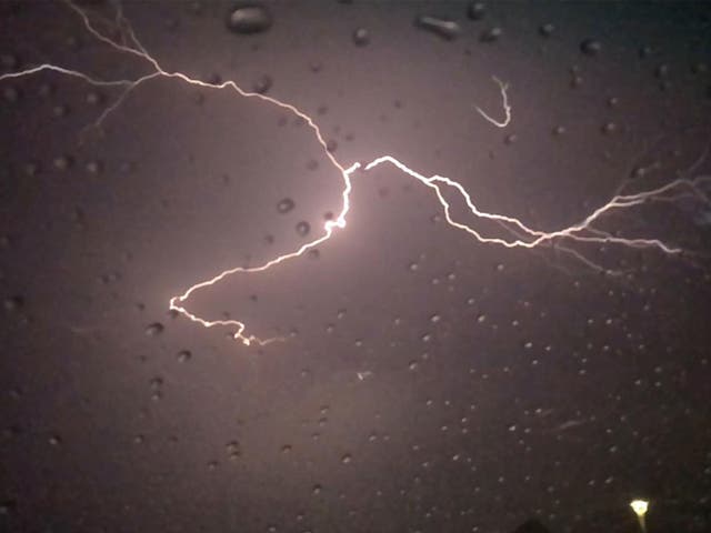 Forked lightning carves through the night sky over Phoenix, Arizona
