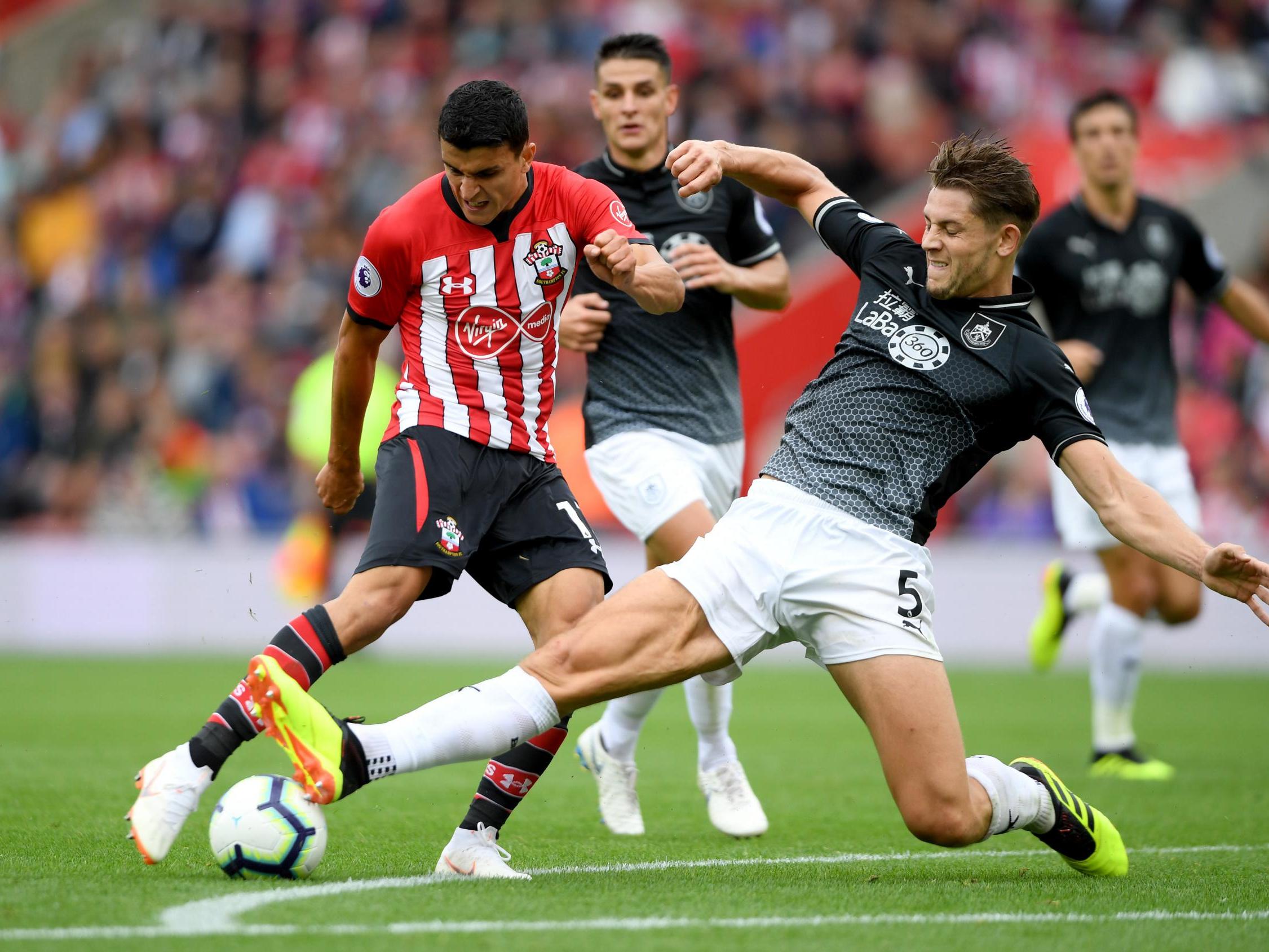 Mohamed Elyounoussi shoots under pressure from James Tarkowski