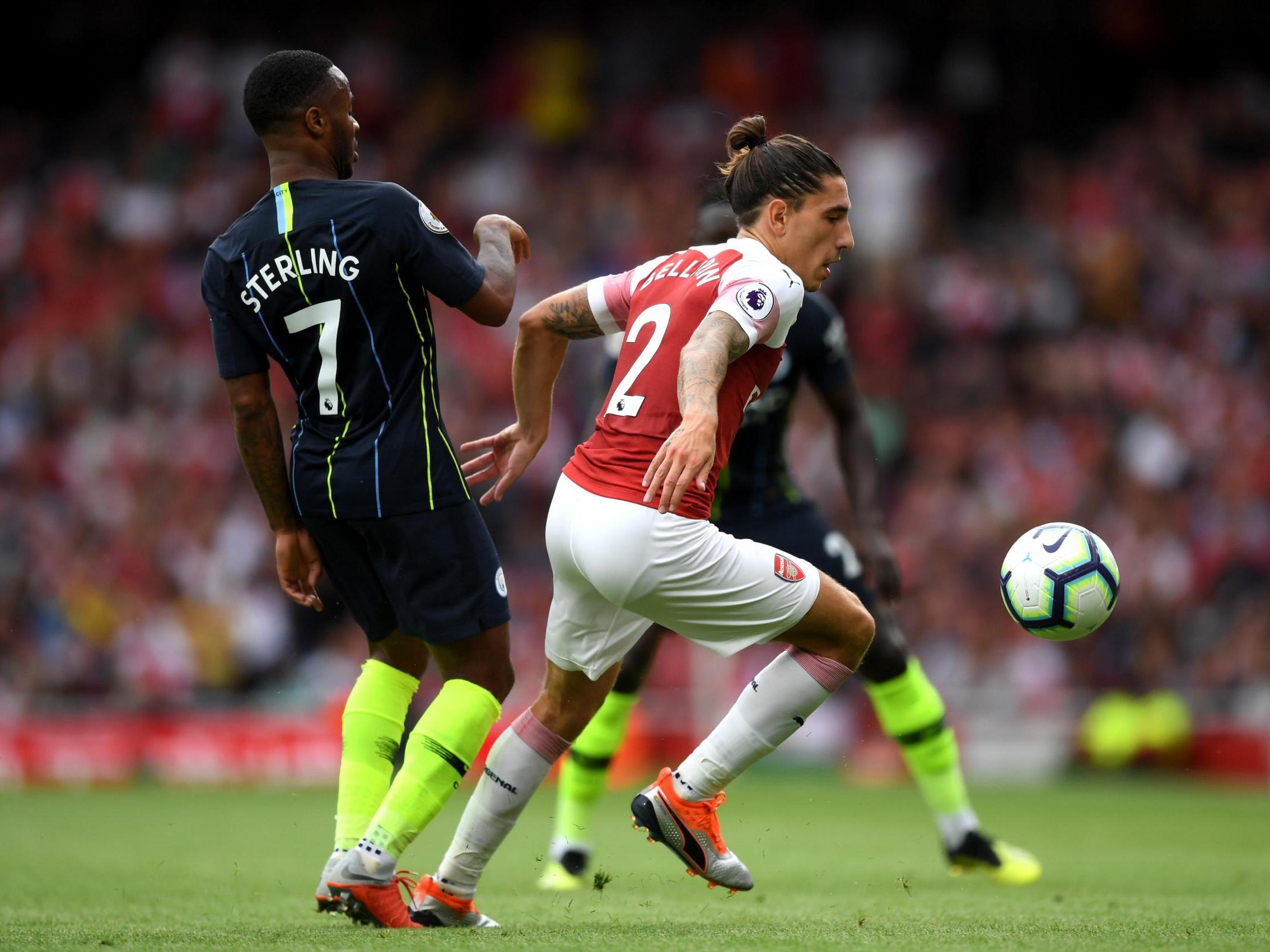 Hector Bellerin turns to get away from Raheem Sterling