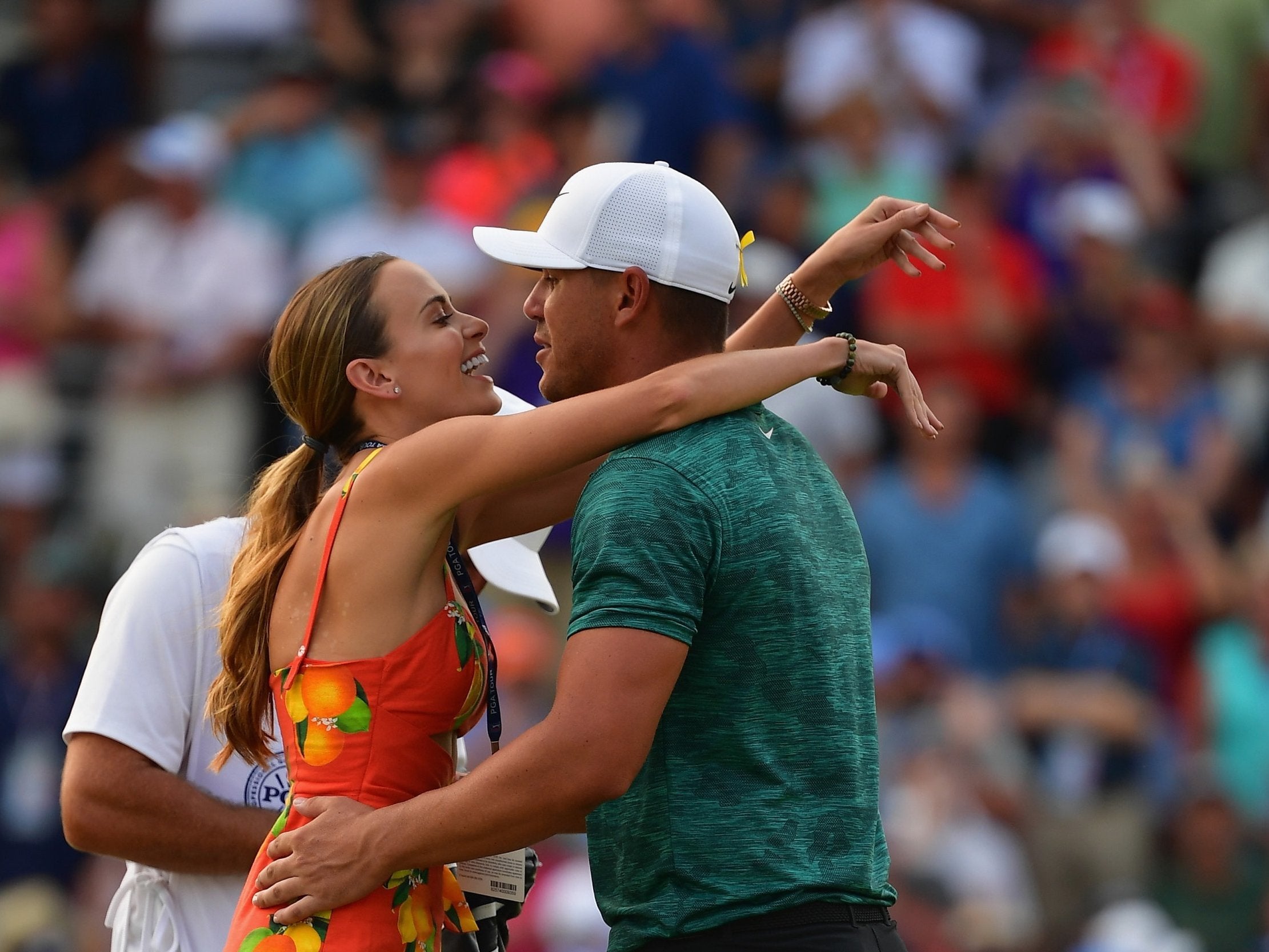 Brooks Koepka celebrates with his girlfriend, Jena Sims, after winning the 2018 PGA Championship