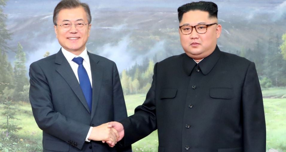 South Korean President Moon Jae-in shakes hands with North Korean leader Kim Jong Un during their summit in May