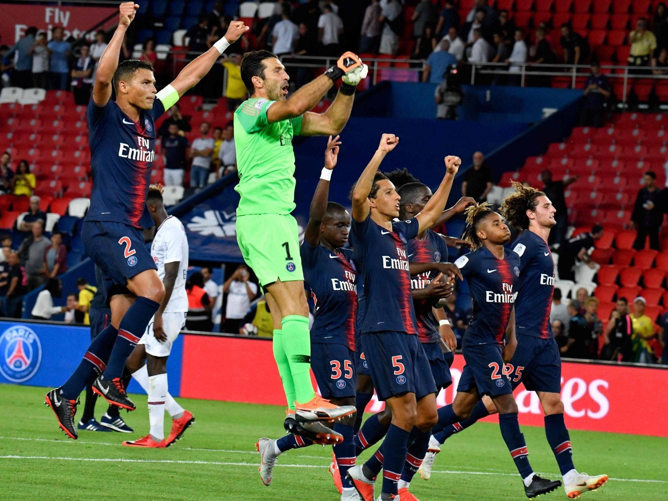 Paris Saint-Germain celebrate their victory over Caen