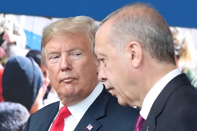 US president Donald Trump looks at Turkish leader Recep Tayyip Erdogan, who has blamed him for his country's currency slump, during a Nato meeting in July 2018