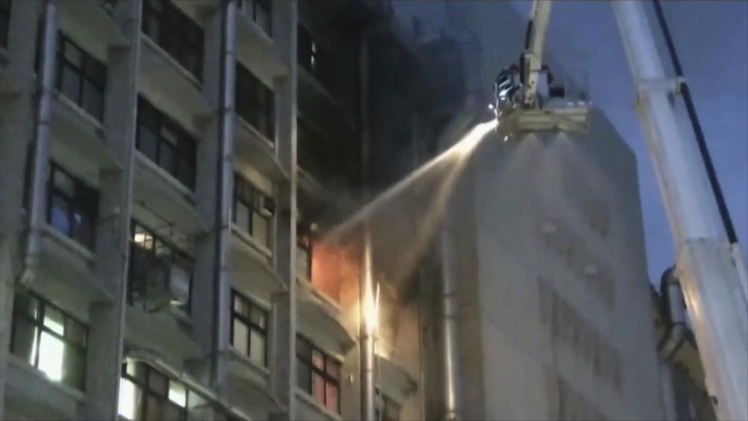 Firefighters try to extinguish the blaze at Taipei Hospital