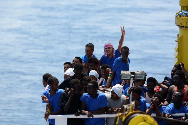 Migrants on board the MV Aquarius rescue ship after being rescued by the boat