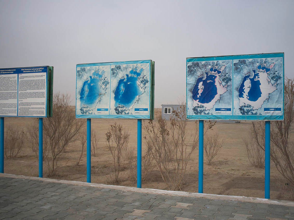 Signs in Muynak show the disappearance of the once vast body of water (Aleksandr Zykov)