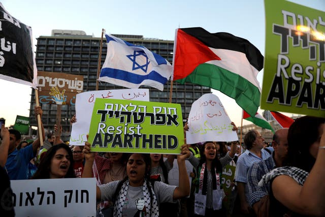 Israeli Arabs and their supporters take part in a rally to protest against Jewish nation state law in Rabin Square in Tel Aviv on 11 August 2018