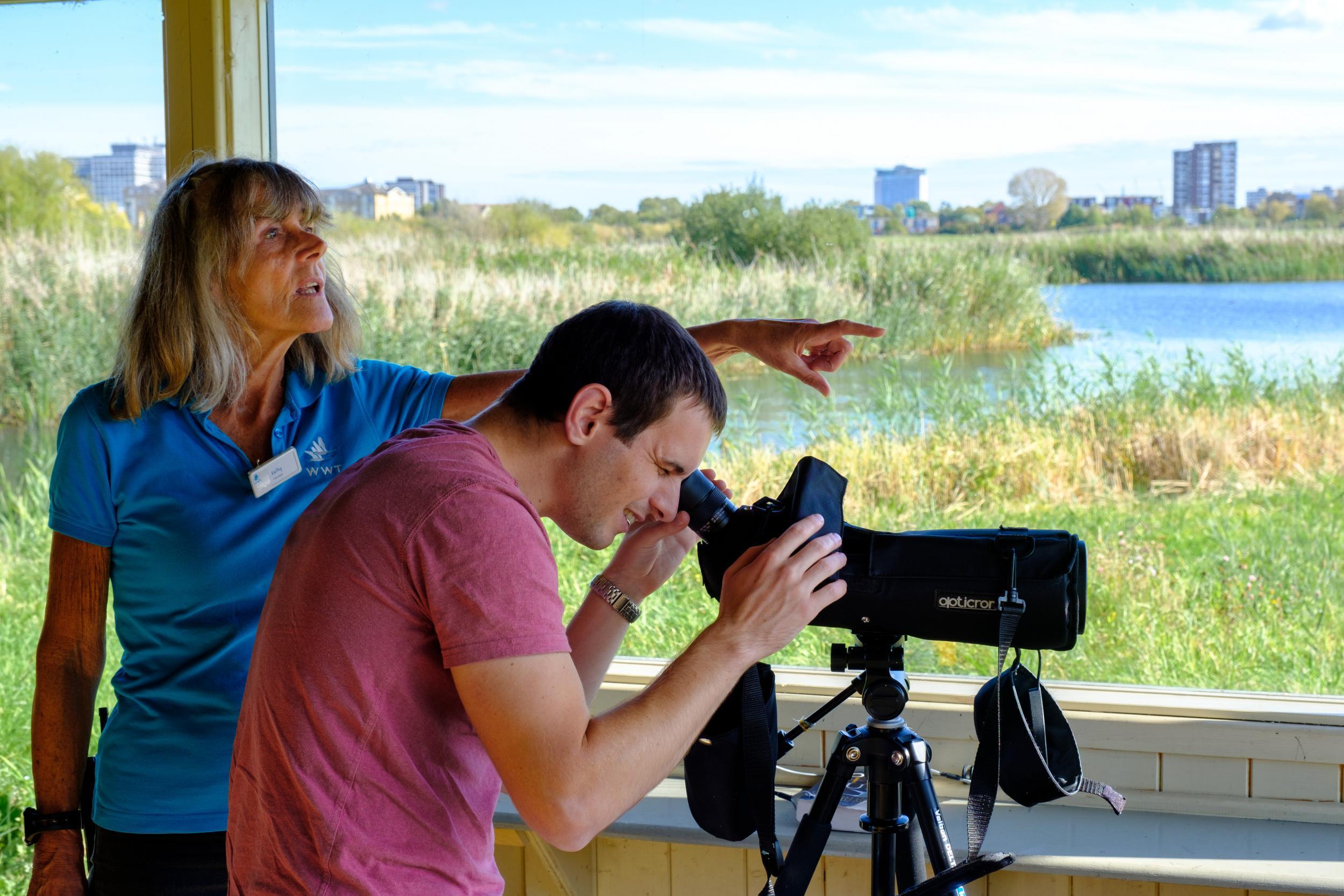 Spotting species: the Wetland Centre experts help visitors to identify birds