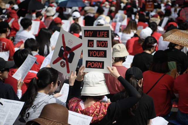 Female protesters call for South Korea's government to crack down on widespread spycam porn crimes at a rally in Seoul on 7 July 2018