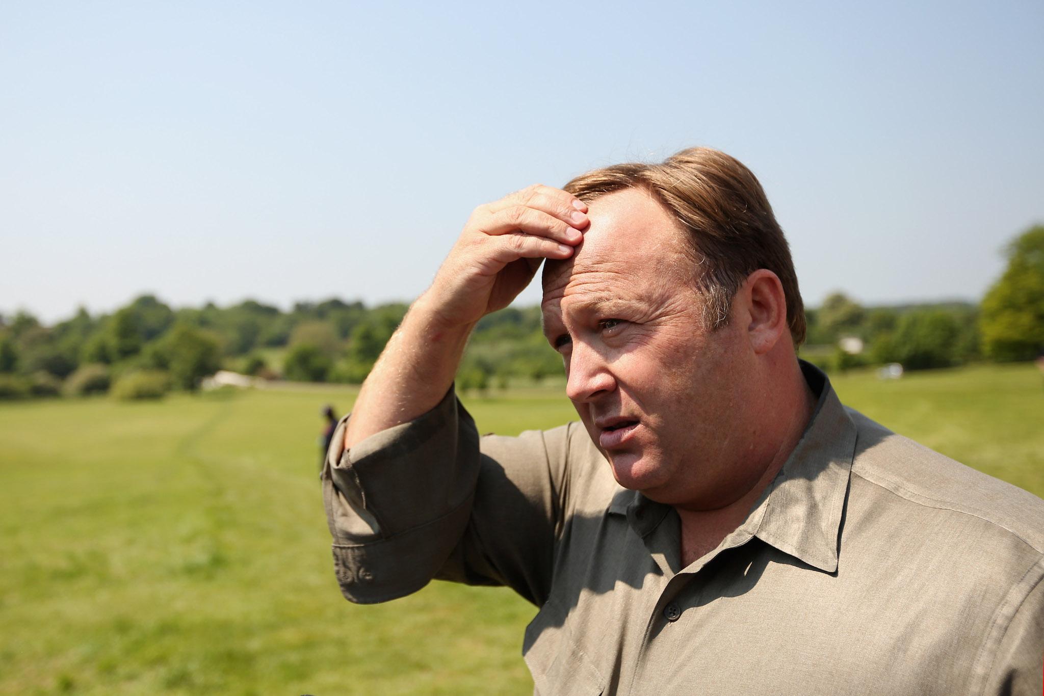 Alex Jones, an American radio host, author and conspiracy theorist, addresses media and protesters in the protester encampment outside The Grove hotel, which is hosting the annual Bilderberg conference, on June 6, 2013 in Watford, England