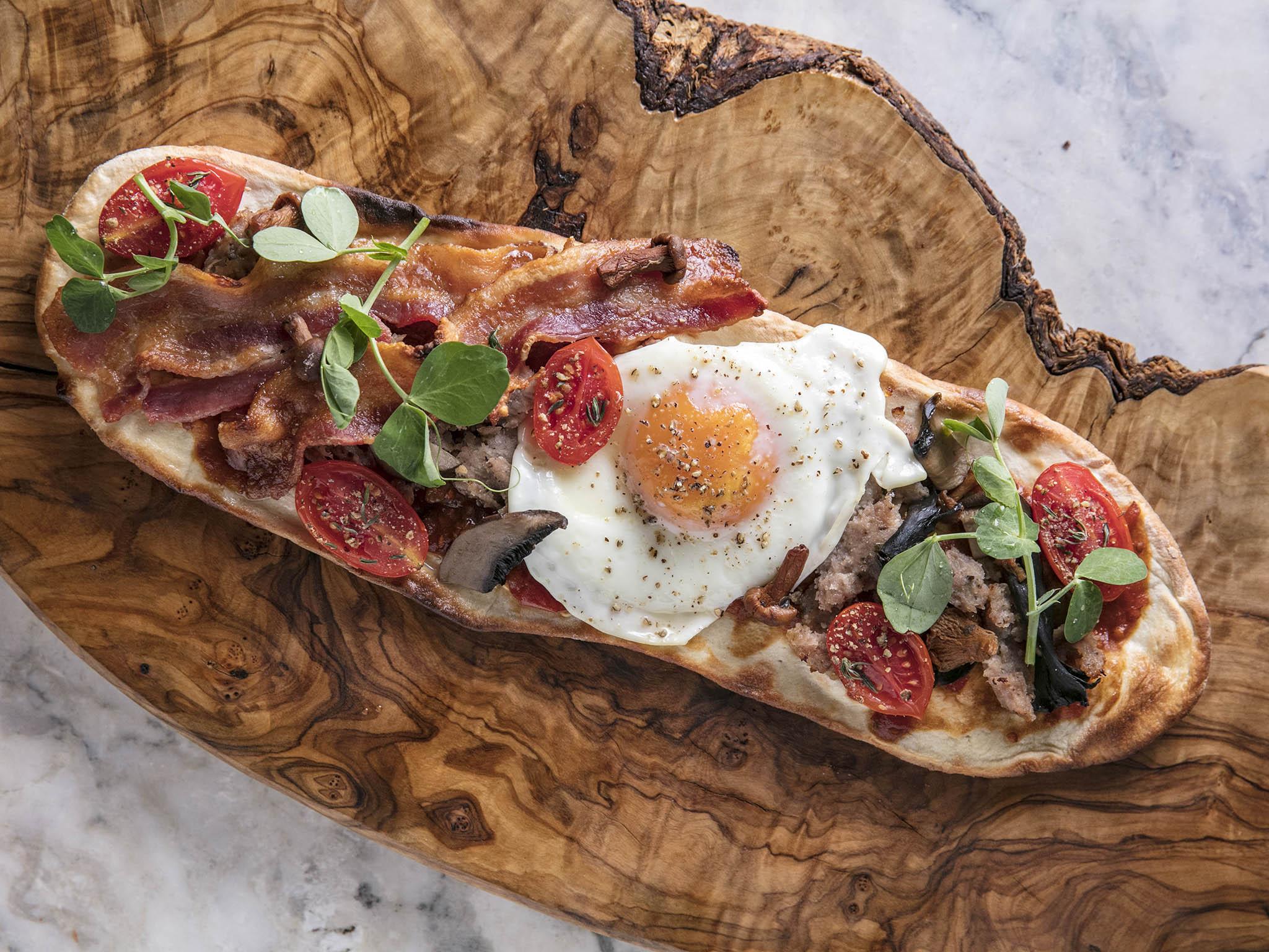 Full English flatbread, baked beans and pea shoots