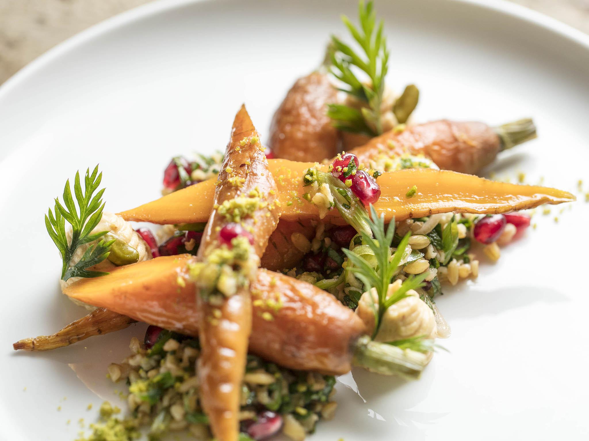 Roasted carrots, freekeh, pomegranate molasses, green onions, pistachios and sunflower seeds