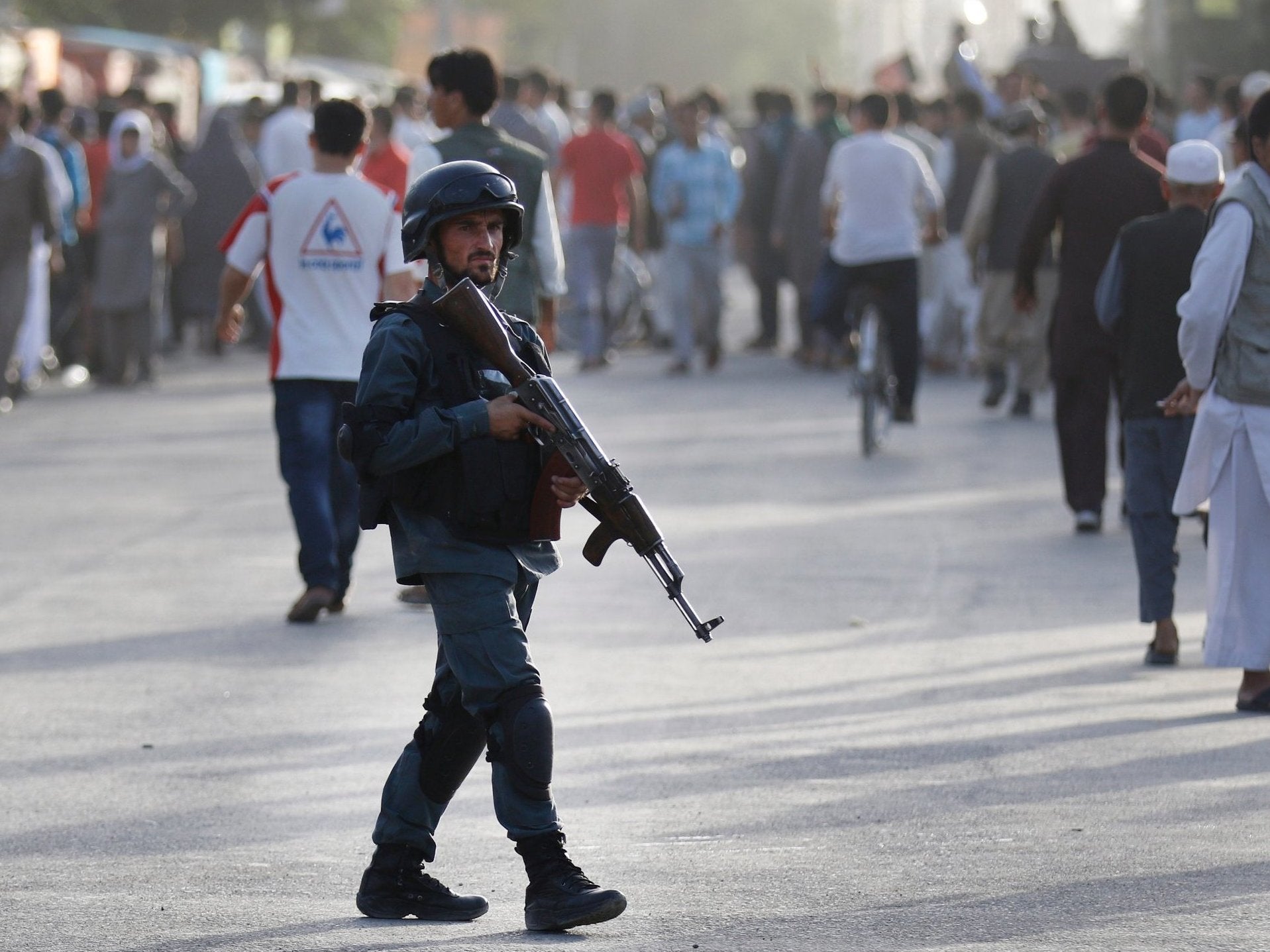 Afghan security patrols at the scene of a suicide attack in Kabul, Afghanistan