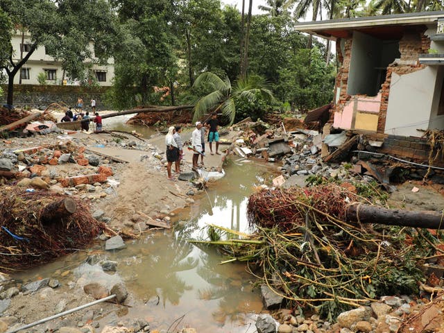 Houses were destroyed by flood waters as flash floods triggered by annual monsoon rains caused havoc