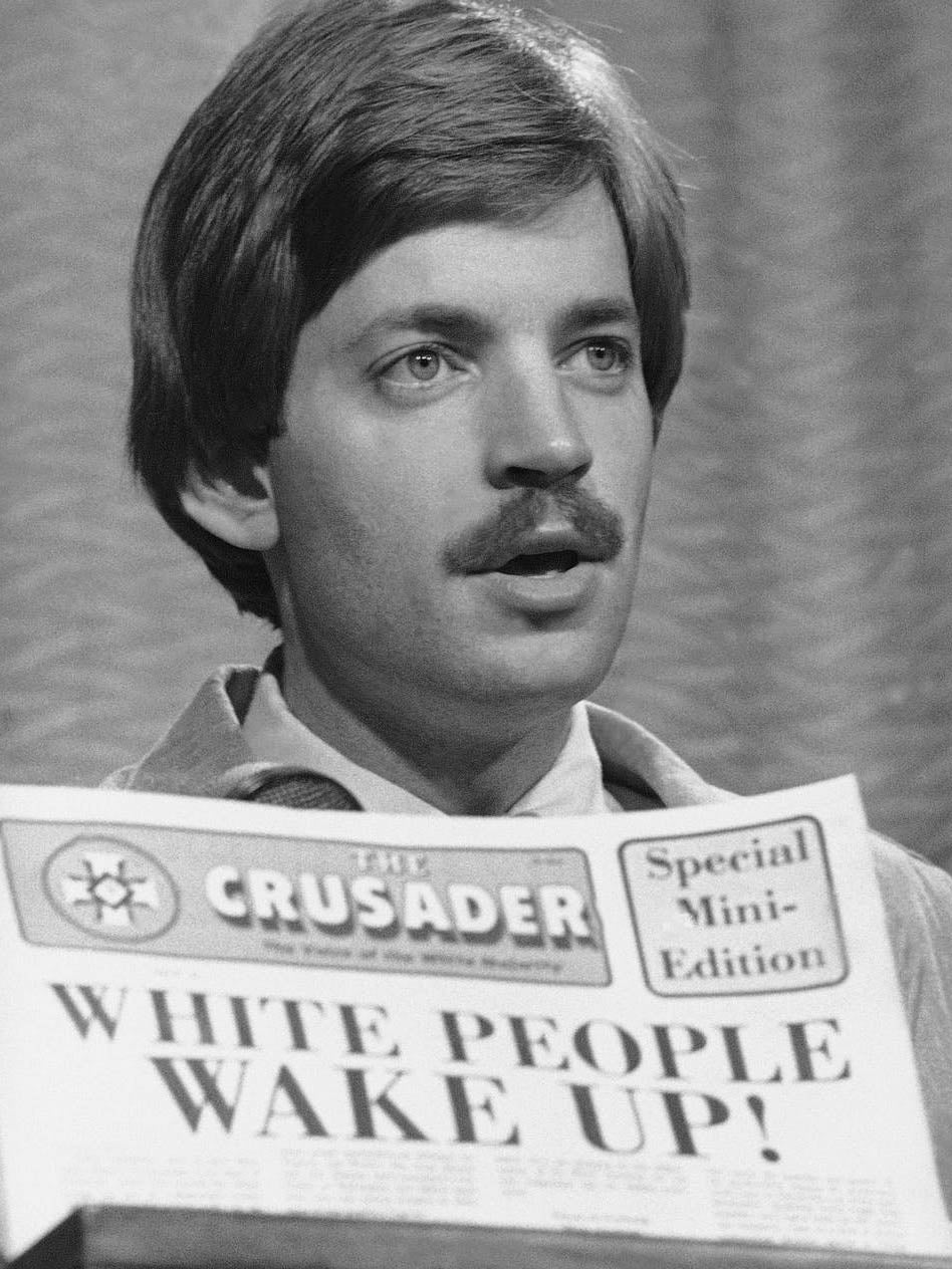 David Duke with the Ku Klux Klan’s newspaper The Crusader in 1977 (AP)