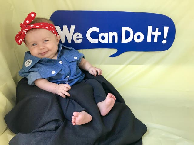 Liberty dressed as Rosie the Riveter