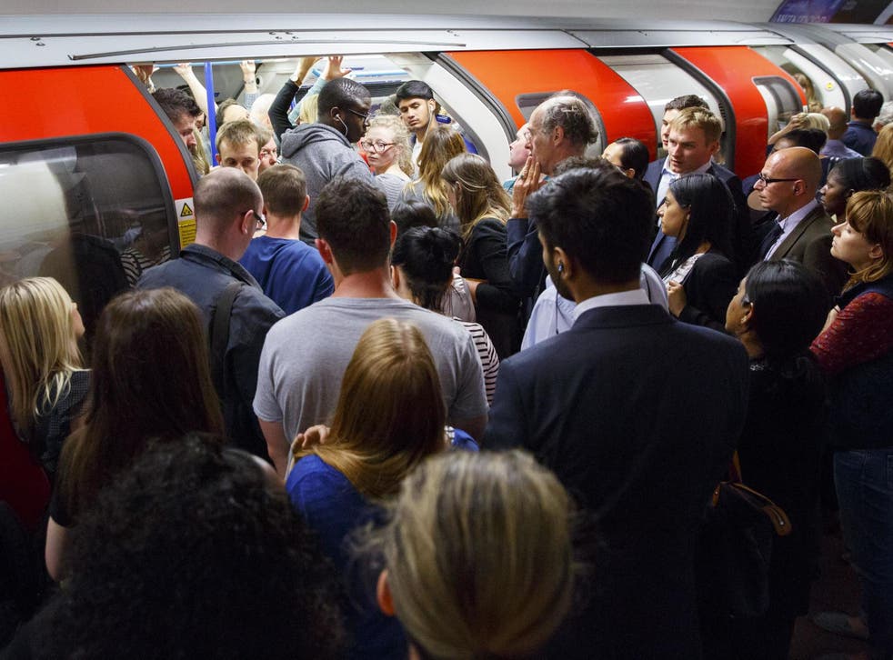 Commuters queuing for Victoria line trains at Green Park Tube station