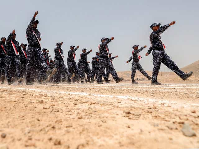 UAE-trained cadets of the Yemeni police, supporting forces loyal to the Saudi and UAE-backed government, marching during their graduation in the southeastern port city of Mukalla 