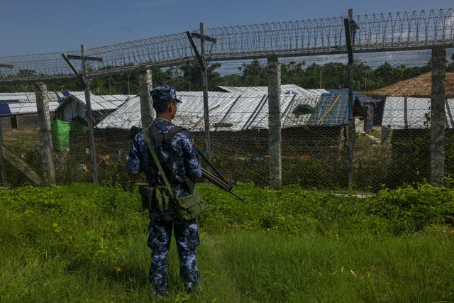 A Myanmar border guard policeman patrols along the border between Myanmar and Bangladesh in Rakhine state, June 2018