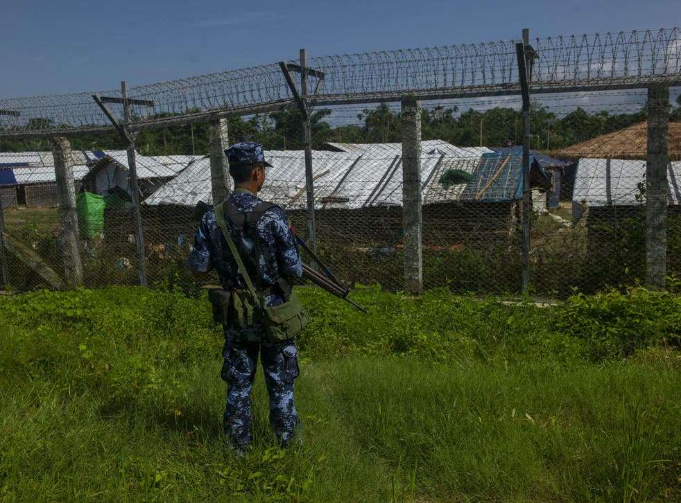 A Myanmar border guard policeman patrols along the border between Myanmar and Bangladesh in Rakhine state, June 2018