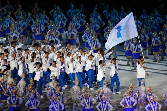 Athletes from North and South Korea marched behind a unified flag at the Asian Games