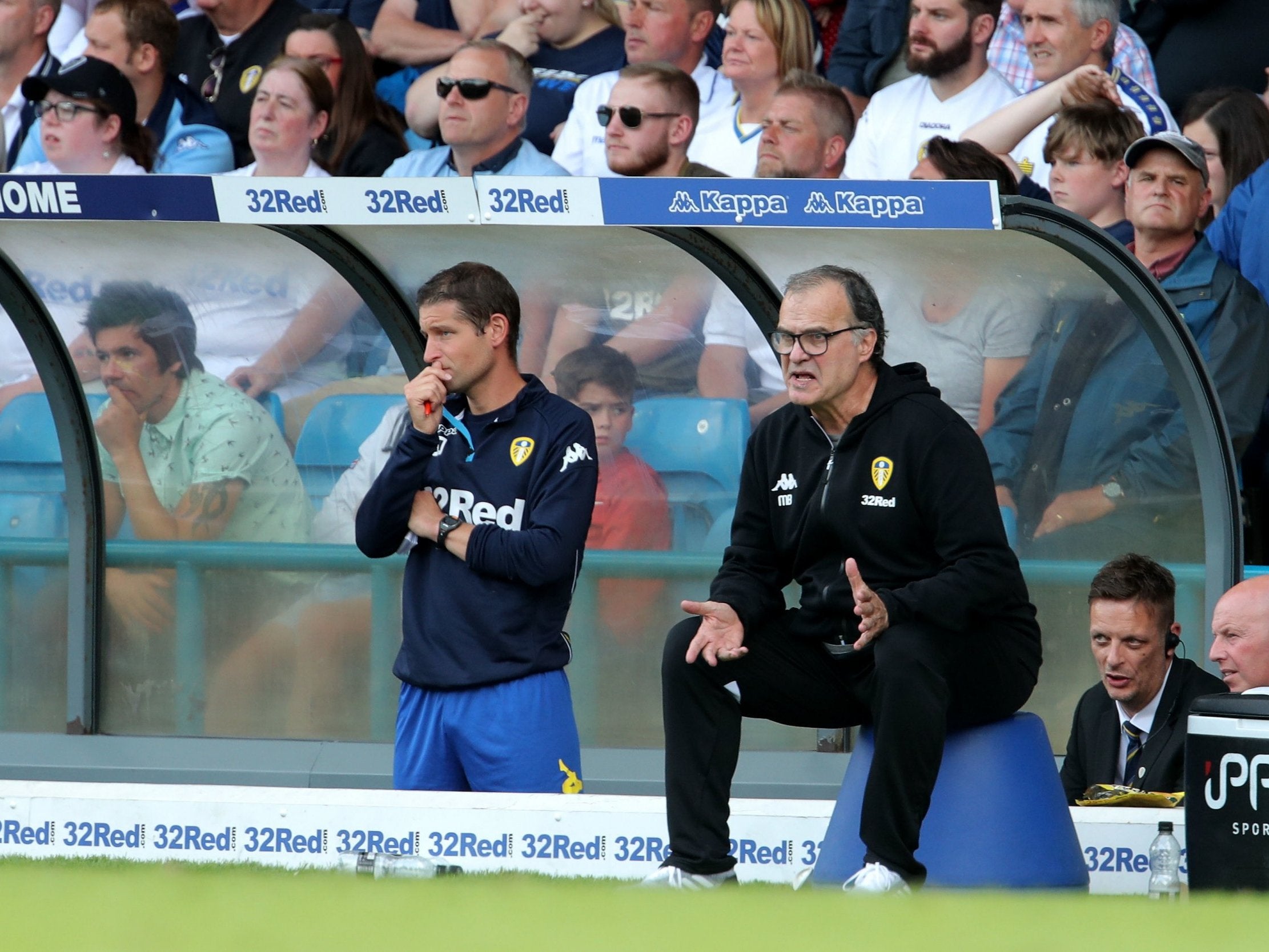 Marcelo Bielsa sits on his blue bucket in the technical area