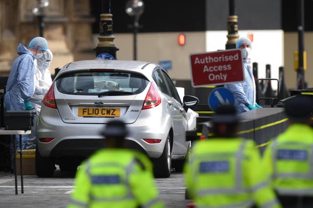 The car crashed into security barriers outside the Houses of Parliament