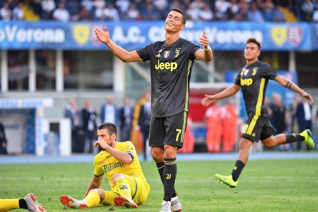 Juventus' Portuguese forward Cristiano Ronaldo reacts after missing a shot during the Italian Serie A football match AC Chievo vs Juventus at the Marcantonio-Bentegodi stadium in Verona on August 18, 2018