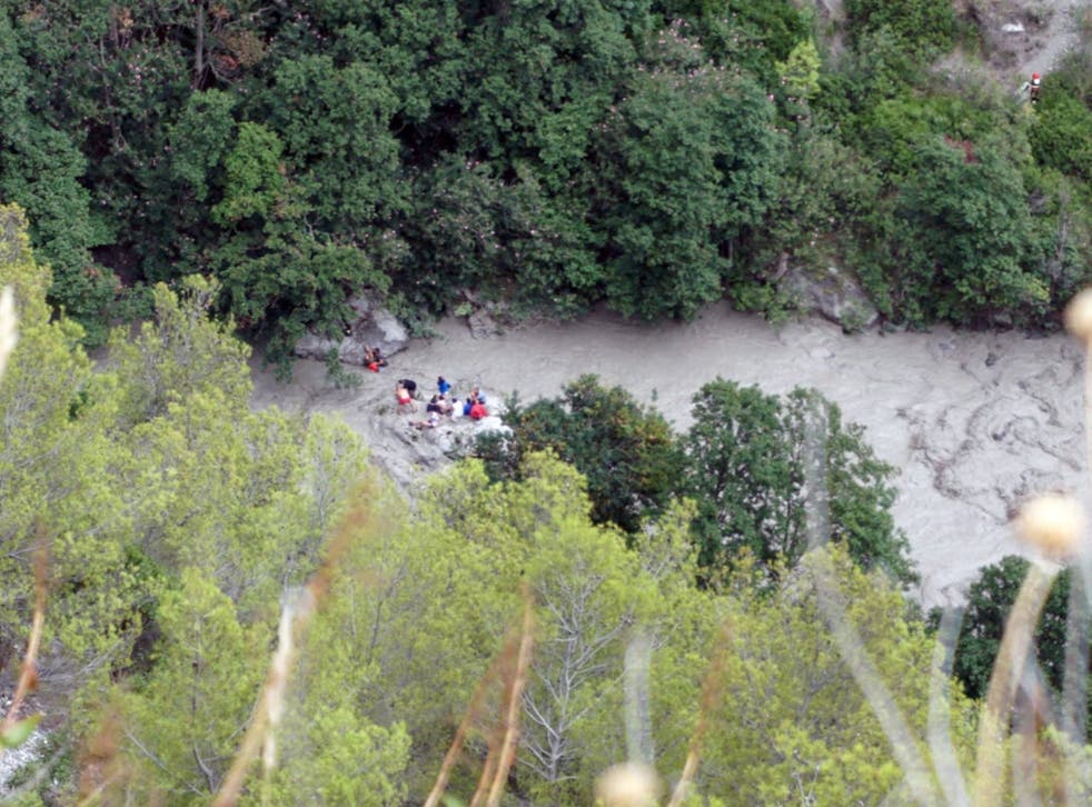Rescuers conduct recovery operations in the Raganello Gorge in Civita, southern Italy