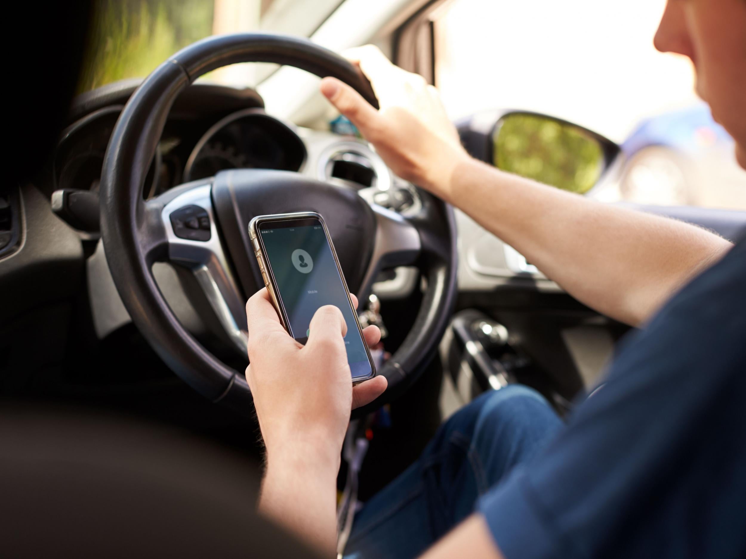Nearly a third of drivers confessed to checking their mobile phone when behind the wheel