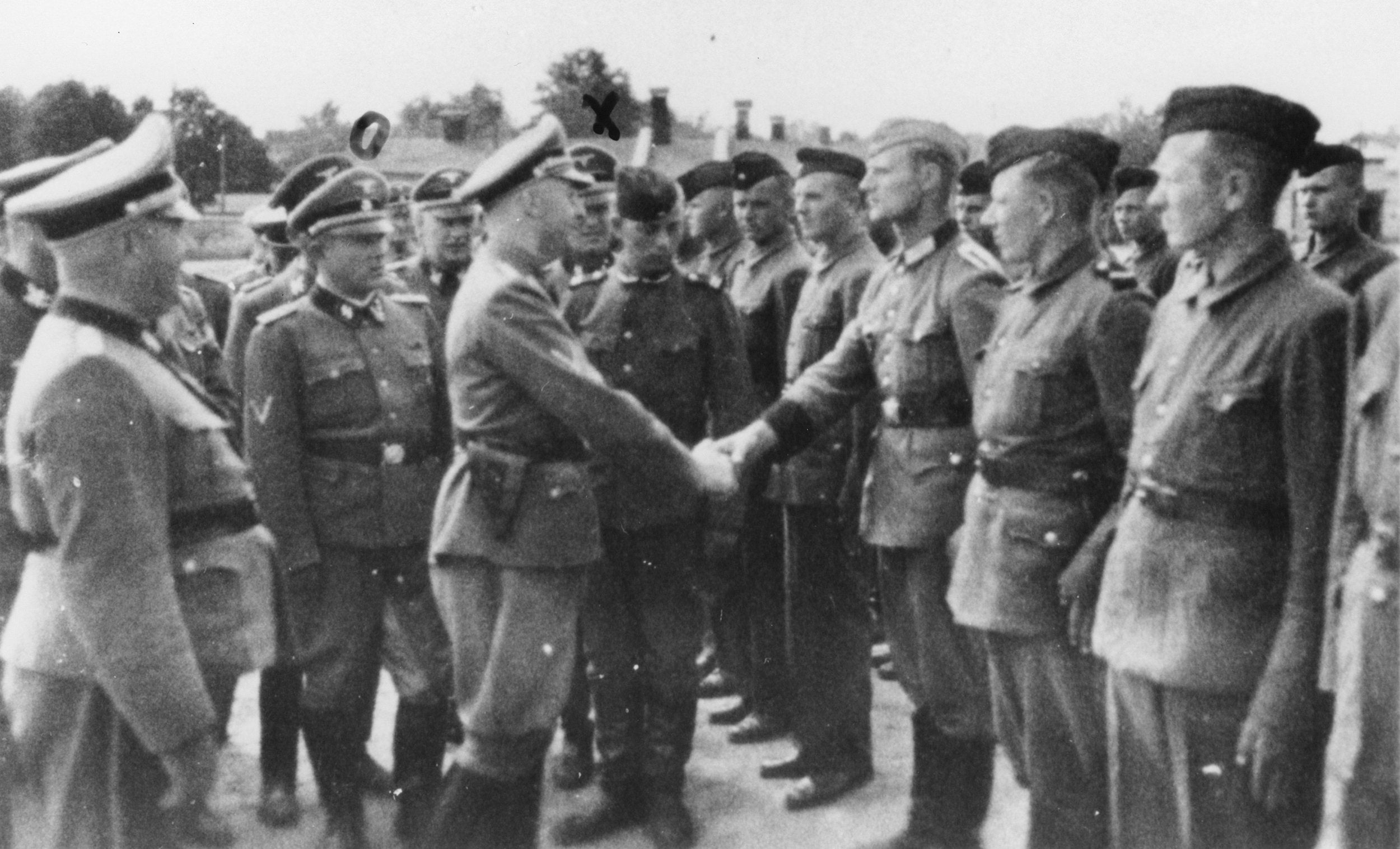 Heinrich Himmler shakes hands with new guard recruits at the Trawniki concentration camp in 1942