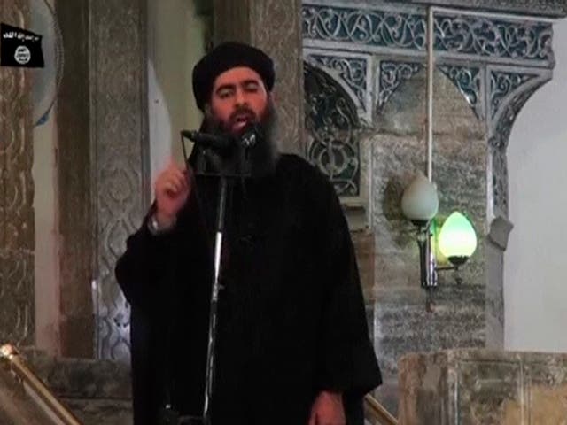 <p>Abu Bakr al-Baghdadi makes his first public appearance at a mosque in Iraq</p>