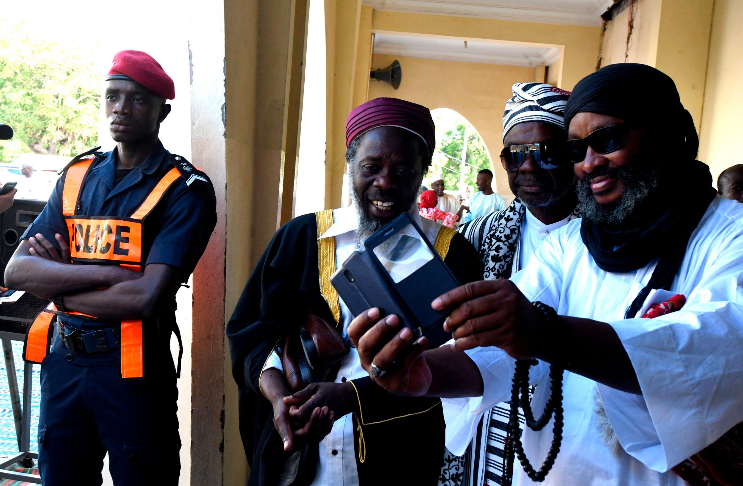 People take a selfie during Eid-El-Kabir festival in Dakar